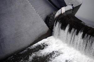 A picture of the flowing water. The dam is designed to regulate the water level in rivers within the city and to provide technical water to industrial objects photo