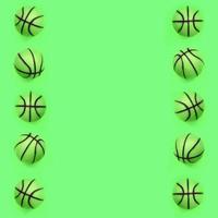 Many small green balls for basketball sport game lies on texture background