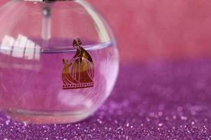 TERNOPIL, UKRAINE - SEPTEMBER 2, 2022 Lanvin Eclat Darpege perfume bottle on shiny glitter background in purple colors photo