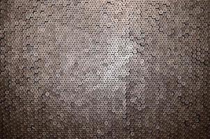 Pattern of 12 gauge cartridges for shotgun bullets. Shells for hunting rifle close up. Backdrop for shooting range or ammunition trade concepts photo