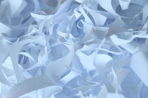 Shredded paper texture background, top view of many white paper strips. Pile of cut paper like box filler for shipping fragile items photo