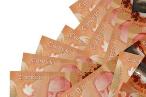 50 Canadian dollars bills lies in different order isolated on white. Local banking or money making concept photo