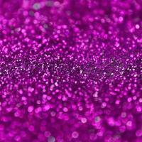 Pink decorative sequins. Background image with shiny bokeh lights from small elements photo