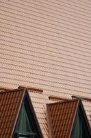The house is equipped with high-quality roofing of metal tiles. A good example of perfect modern roofing. The building is reliably protected from adverse weather conditions photo