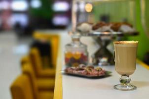 Fresh cappuccino with some sweets photo