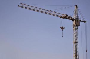 Tower crane against a blue sky photo