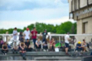 Defocused image of a lot of people with bmx bikes. Meeting of fans of extreme sports photo