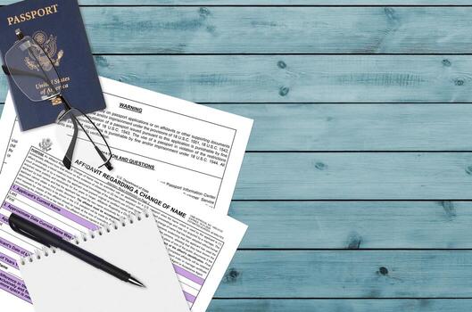 Department of State form DS60 Affidavit Regarding a change of name lies on table and ready to fill. Paperwork during operations with US Passport concept photo