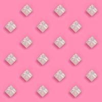 A lot of pink gift boxes lies on texture background of fashion pastel pink color paper in minimal concept. Abstract trendy pattern photo