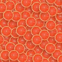 Pattern of red grapefruit citrus slices. Citrus flat lay photo