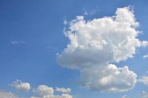 Beautiful blue sky background template with some space for input text message below isolated on blue photo
