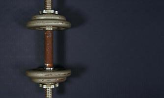 Old rusty iron dumbbells on the handles.fitness equipment background concept photo