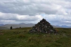 Large Rock Pile Marking the Dirt Footpath photo