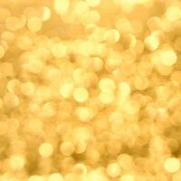 The Golden glow of Bokeh . Abstract blurred glowing background. photo