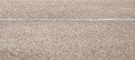 Texture of road asphalt with markup. The foreground in the blur. photo