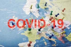 Map of Europe with colored buttons indicating cities and coordinates of the spread of the covid-19 coronavirus pandemic infection. photo