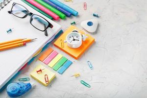 School stationery lies on a gray textural background with free space. photo