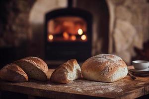 Freshly baked bread on rustic wooden table with fireplace in the background. photo