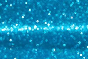 Blue defocused lights Christmas glitter, sparkle and bokeh. New Year background. Copy space photo