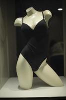 Mannequin in underwear. Women's underwear on showcase. Black clothes. photo
