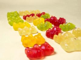 The gummy bears lie nearby. Sweets in the form of animals. photo