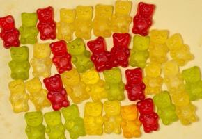 The gummy bears lie nearby. Sweets in the form of animals. photo