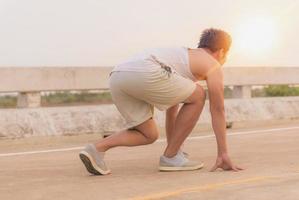 man with runner on the street be running for exercise. photo