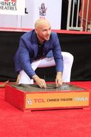 LOS ANGELES - DEC 14 - Pitbull at the Pitbull Hand and Footprint Ceremony at the TCL Chinese Theater IMAX on December 14, 2018 in Los Angeles, CA photo