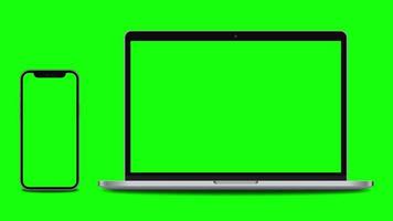 Smartphone and laptop with green screen slide into the camera frame. 4K animation for presentation on mockup screen