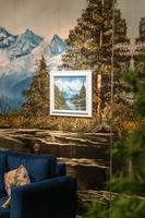 young latin man surrounded by mirrored synthetic pine trees, christmas scene photo