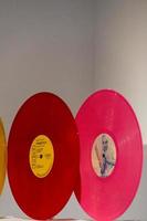 Vinyl long play record in retro bright neon colors on a white background. record concept photo