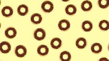 Seamless pattern, texture from round sweet tasty nourishing hot fresh donuts, pastries, sugar-coated cookies in brown chocolate confectionery glaze on a yellow background. Vector illustration