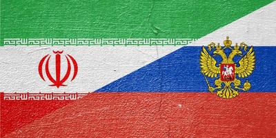 The flag of Russia and Iran on a cracked plastered wall. Concept of cooperation between two countries photo