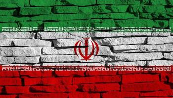 Flag of the Islamic Republic of Iran on a stone wall texture. photo