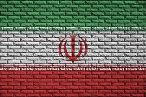 Iran flag is painted onto an old brick wall photo