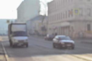 Blurred landscape of highway with cars in foggy morning photo