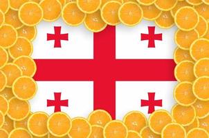 Georgia flag  in fresh citrus fruit slices frame photo