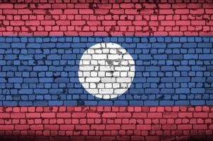 Laos flag is painted onto an old brick wall photo