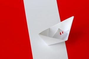 Peru flag depicted on paper origami ship closeup. Handmade arts concept photo