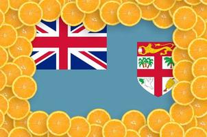 Fiji flag  in fresh citrus fruit slices frame photo