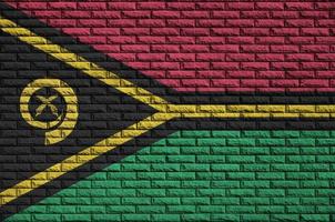 Vanuatu flag is painted onto an old brick wall photo