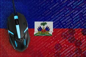 Haiti flag  and computer mouse. Digital threat, illegal actions on the Internet photo