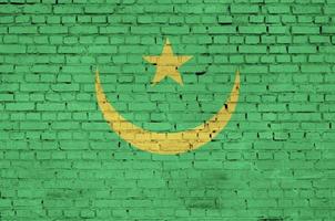 Mauritania flag is painted onto an old brick wall photo