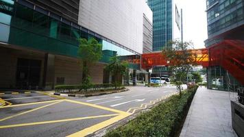 View from sidewalk of a business or medical center with sky walkway video