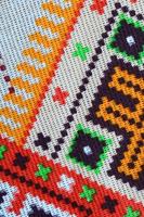 Traditional Ukrainian folk art knitted embroidery pattern on textile fabric photo