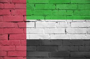 United Arab Emirates flag is painted onto an old brick wall photo