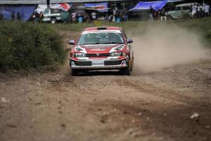 YOGYAKARTA, INDONESIA - October 16, 2022 - Racers compete in the King's Cup Sprint Rally Jogja photo