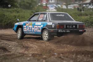 YOGYAKARTA, INDONESIA - October 16, 2022 - Racers compete in the King's Cup Sprint Rally Jogja photo