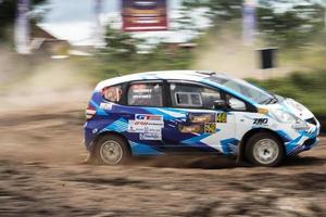 YOGYAKARTA, INDONESIA - October 16, 2022 - Racers compete in the King's Cup Sprint Rally Jogja photo