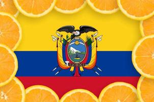 Ecuador flag  in fresh citrus fruit slices frame photo